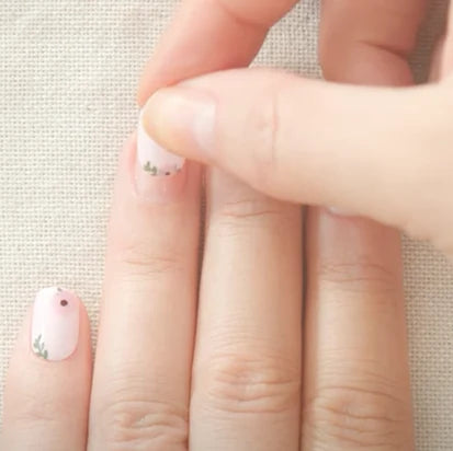 Applying Ultra Strong Nail Glue with brush applicator for secure and long-lasting press-on manicure at home