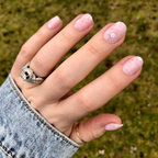 Cowgirl Boot Boogie - Press-On | Extra Short | Round showing pink floral and boot designs on short false nails outdoors