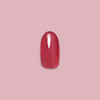 LD - Press-On | Medium | Oval showing single medium oval rosy-toned press-on false nail on soft pink background