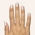 Hand with almond-shaped nails polished in subtle pinky grey shade using LHG - Gel for a neutral mani look thumbnail
