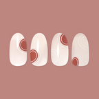 Layered Circles - Press-On | Medium | Oval neutral press-on nails with burnt orange circles and white swirl accents manicure