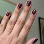 Let's Stay In gel polish on short nails showing deep maroon-brown for a cozy, long-lasting manicure by Olive and June