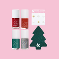 Mini Merry Set with four festive nail polishes, metallic star nail art stickers, and a tree-shaped nail file on pink background thumbnail