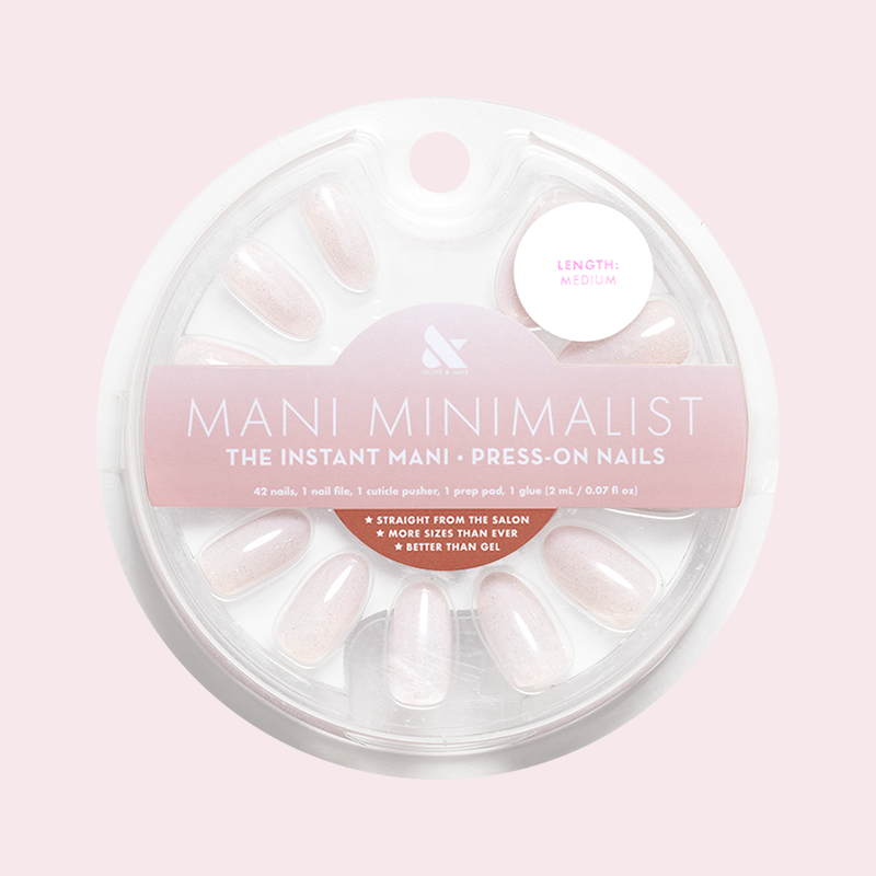 Milky Micro Glitter - Press-On | Medium | Oval showing medium oval false nails with sheer milky base and subtle shimmer in round packaging