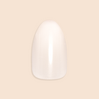 Milky Syrup Gradient - Press-On | Medium | Almond showing a single medium almond false nail in soft milky white gradient polish