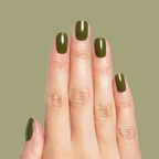 Hand with nails painted in smooth glossy Mossy gel polish showing quick dry manicure on natural nails