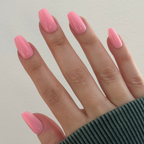 O&J Pink - Press-On | Medium | Coffin medium cotton candy pink false nails shown on hand with soft natural light