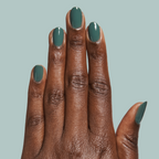 Hand with oval nails painted in Still Life of Flowers - Gel mossy green gel polish against soft muted background