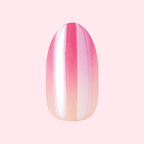 Pink Chrome Gradient | Medium | Oval - Tab Press-On showing a soft pink to peach shimmering mani in oval shape