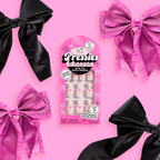 Pink Everything Please - Pressies | Extra Short Short | Round showing baby pink press-on nails with bright pink ribbon design in packaging