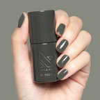 Is It Smoky In Here? Gel on short natural nails with deep charcoal gray for a sleek manicure by Olive and June