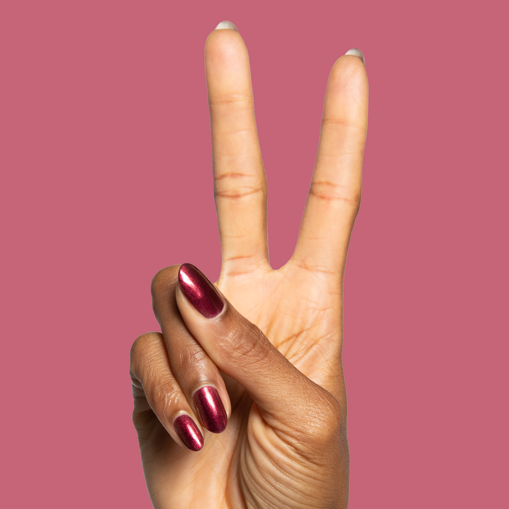 Budget? What Budget deep rose-orange duochrome gel polish on almond-shaped nails for a chic mani by Olive and June