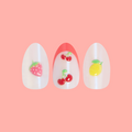 Puffy Fruits - Press-On | Medium | Oval on customer hand