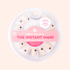 Puffy Vampy Heart - Press-On | Extra Short | Squoval showing nude extra short squoval false nails with 3D dark heart accents in round packaging