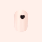Puffy Vampy Heart - Press-On | Extra Short | Squoval showing nude nail with 3D black heart accent for mani polish