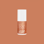 Penny polish bottle showing shiny copper metallic quick dry nail polish by Olive and June on a solid background