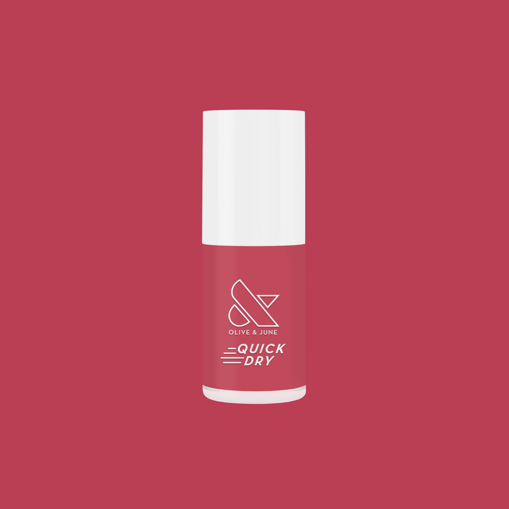 Olive and June Primrose quick dry polish bottle in warm rosy pink perfect for easy at-home manicures
