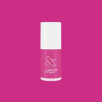 Wildest quick dry gel polish bottle in bold orchid magenta purple shade on solid magenta background