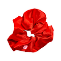 Red Scrunchie made of smooth shiny fabric, perfect for keeping hair back during at home manicures and nail polish application thumbnail