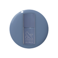 Bottle of Slate - Gel polish in midtone slate blue with a calm and chic finish against a white background