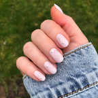 Soft Silver Foil Stars - Press-On | Short | Round showing short round press-on nails with neutral polish and 3D silver star accents outdoors