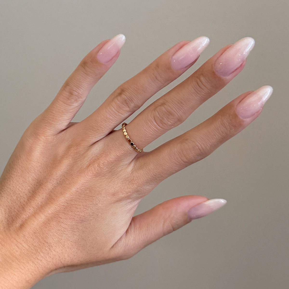 Soft Tint - Builder Gel on long natural nails with subtle sheer blush pink and delicate silver shimmer manicure