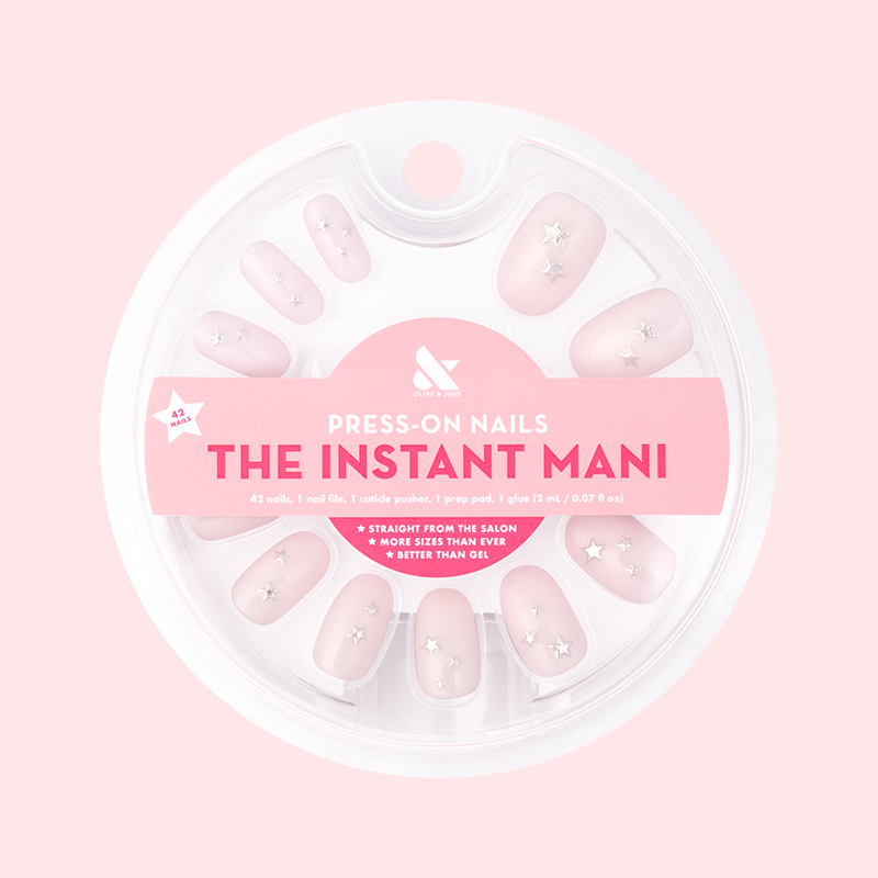 Soft Silver Foil Stars - Press-On | Short | Round showing short round false nails with pink base and 3D silver star accents in packaging