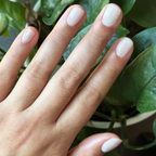 Sugar Glow - Builder Gel applied on short natural nails with a smooth, sheer milky white gel polish finish