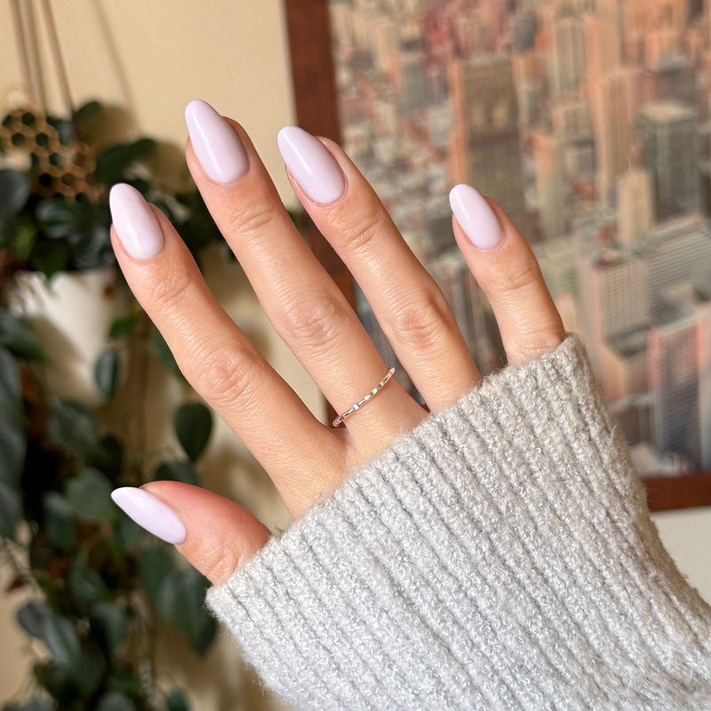 TT - Gel on almond-shaped nails in a soft lavender shade with grey undertones for a delicate mani by Olive and June