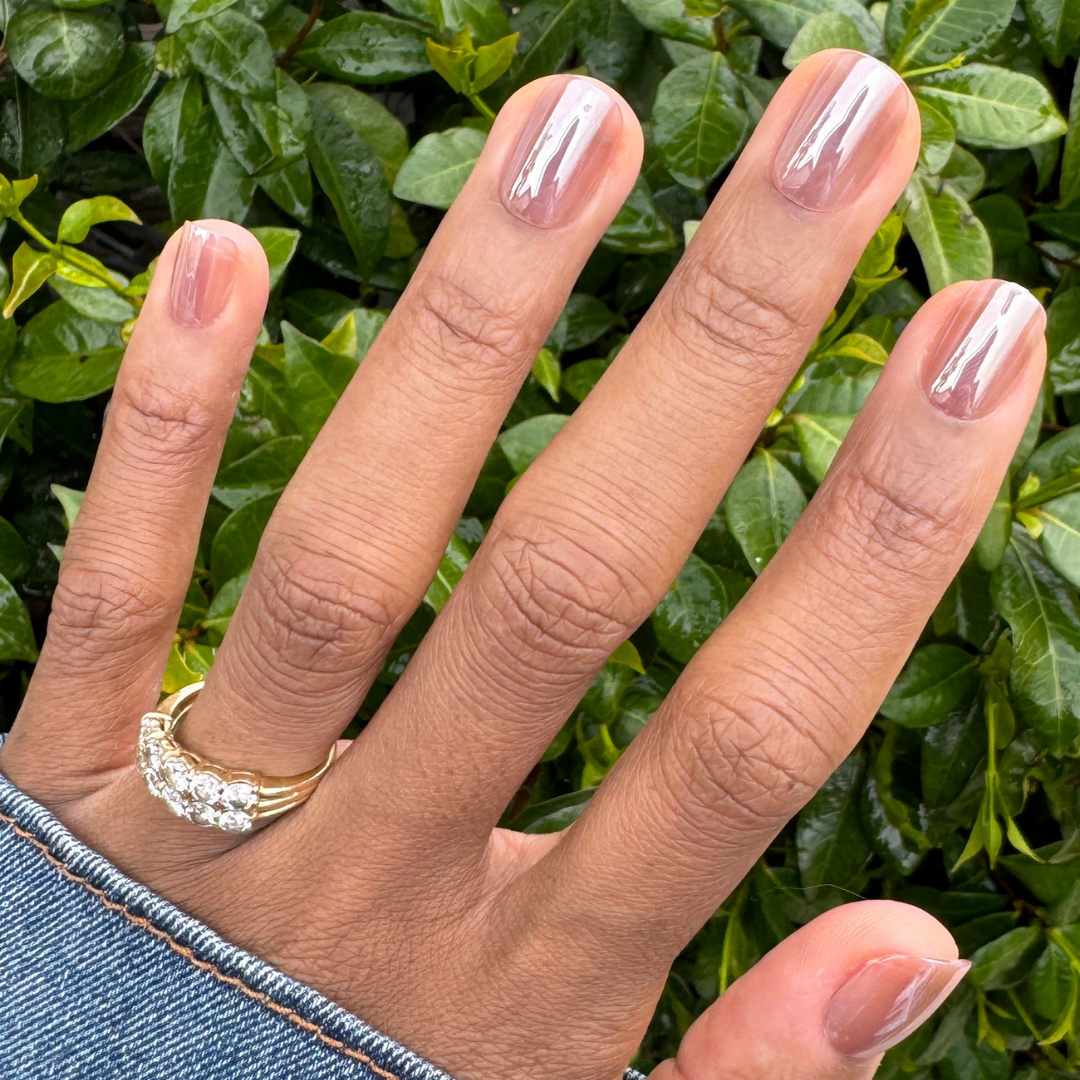 Taupe Jelly Chrome - Press-On | Extra Short | Squoval showing hand with glossy taupe chrome extra short squoval press-on nails