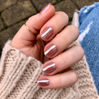 Taupe Jelly Chrome - Press-On | Extra Short | Squoval showing hand with extra short squoval press-on nails in shiny taupe chrome polish
