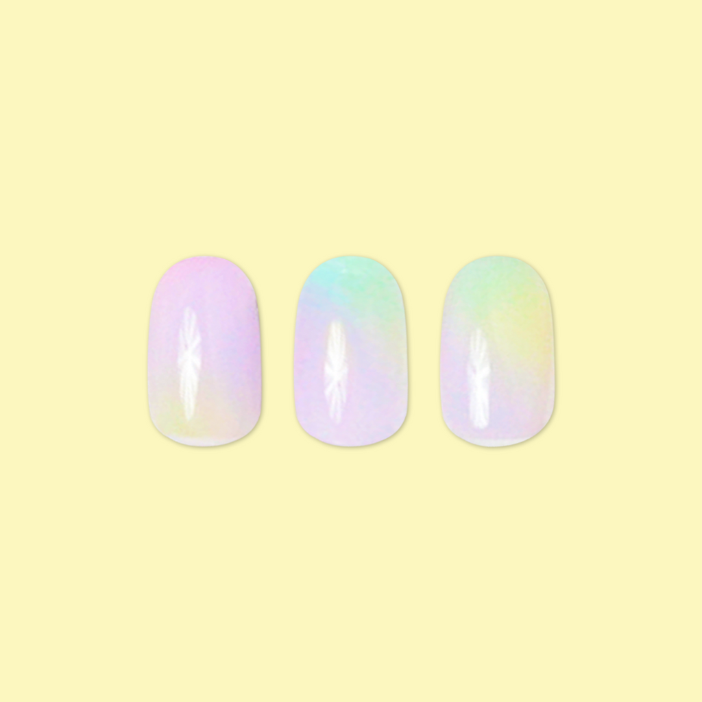 Tie Dye - Press-On | Short | Round showing three short round false nails with pastel rainbow tie-dye design on yellow background