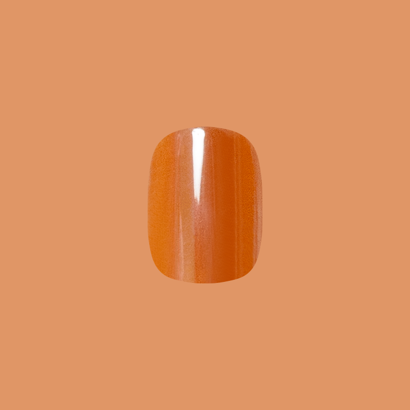 Glazed Pumpkin - Press-On | Short | Squoval single nail in shimmering pumpkin orange for easy at home manicure