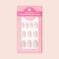 Tutu | Short | Squoval - Tab Press-On nails in soft pastel pink shade displayed in branded packaging for at-home mani.