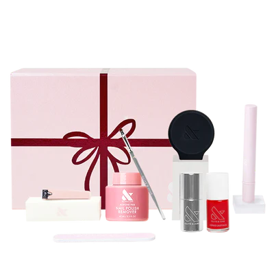 The Mani System manicure kit with polish remover, nail polish, tools, and pink gift box for at-home nail care