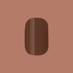 Americano | Short | Squoval - Tab Press-On showing a single glossy coffee brown false nail on muted brown background