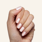 Atlas - Gel on natural nails showing a smooth, pearly white finish for an elegant manicure by Olive and June