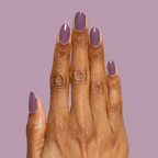 Hand with glossy Cardigan gel polish manicure in warm mauve shade on medium-length nails against mauve background