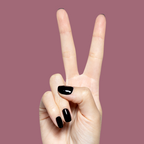Hand showing peace sign with glossy dark plum Covet gel polish manicure on short natural nails against muted mauve backdrop