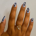 Valentine Mini Polish Set nails with light lavender polish and scattered black heart and speckled accents for a trendy mani look thumbnail