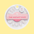 Daisy Chain - Press-On | Short | Round with delicate white daisy print on sheer neutral false nails in circular packaging