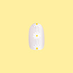 Daisy Chain - Press-On | Short | Round false nail featuring white daisies on sheer neutral background against a yellow backdrop