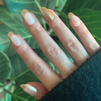 Gold Glimmer French - Press-On | Medium | Oval medium oval nails with solid gold and shiny French tips for easy at-home manicure