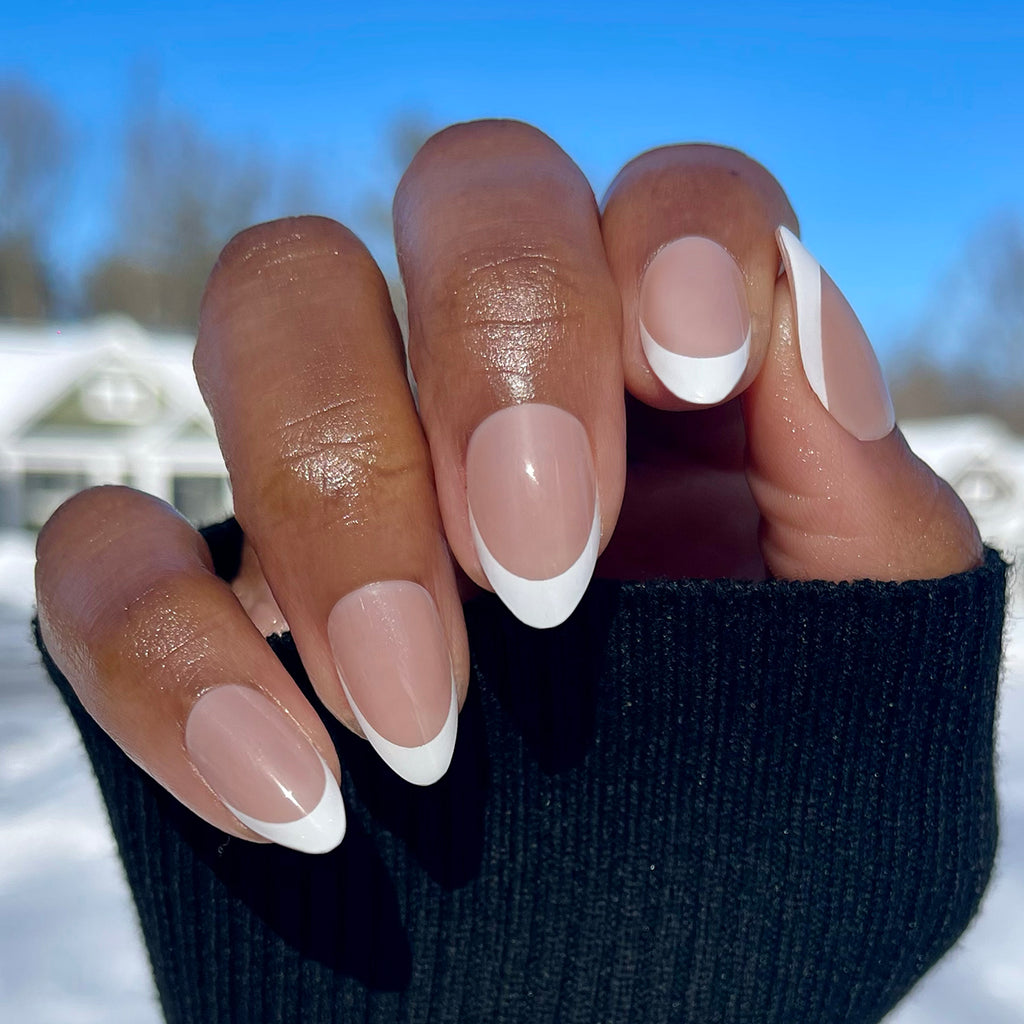 Iconic French - Press-On | Medium | Almond sheer pink base with bold white tips for an easy at-home manicure look