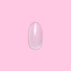 Iridescent Pink - Press-On | Medium | Oval showing single medium oval false nail with soft pink shimmery finish on pink background