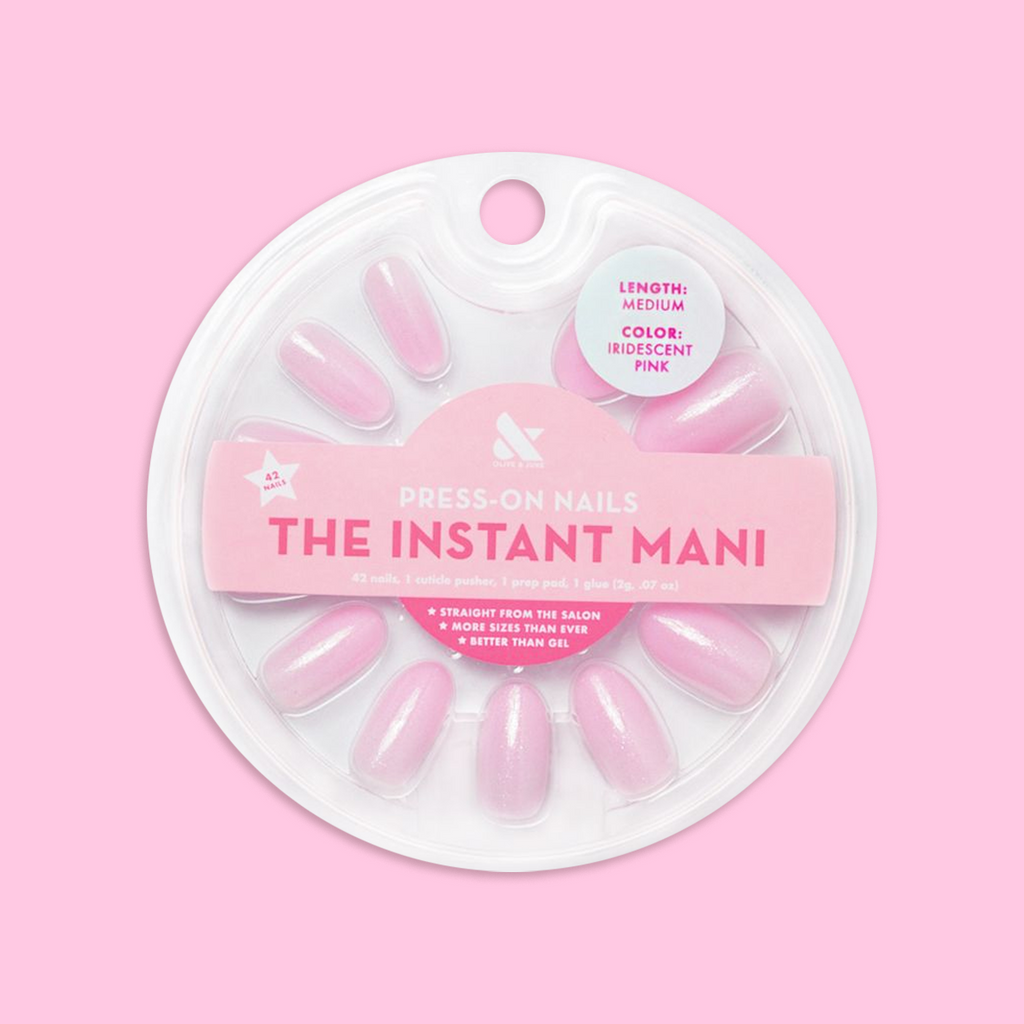 Iridescent Pink - Press-On | Medium | Oval showing medium oval false nails with soft pink iridescent finish in round packaging on pink background
