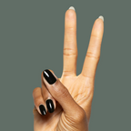 Hand showing peace sign with Latenight ultra-dark olive green quick dry gel polish manicure on natural nails against muted green background