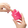 Hands dipping a finger into a bright pink Nourishing Remover Pot for quick, nourishing nail polish removal with care ingredients thumbnail