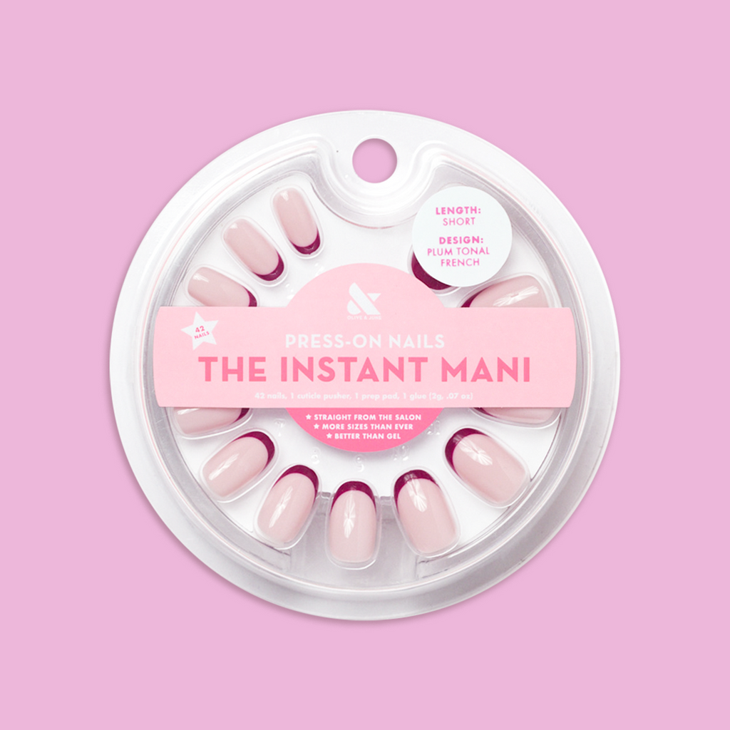 Plum Tonal French - Press-On | Short | Round showing short round press-on nails with plum French tips in clear round packaging