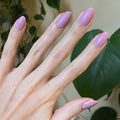 Purple Season manicure with soft shimmering lavender gel polish on natural nails for a smooth, glossy finish by Olive and June thumbnail